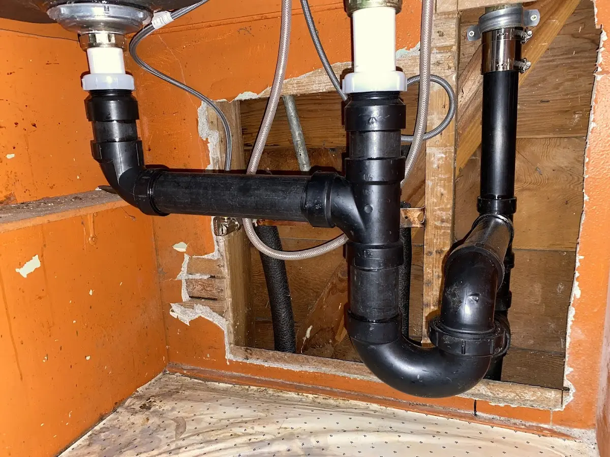 Professional Garbage Disposal Repair equipment and tools on the job in Cary
